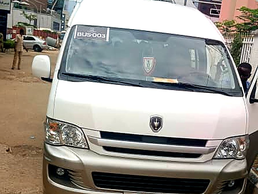 Toyota Hiace crew van carrying a fleet number placard, Abuja Central Business District